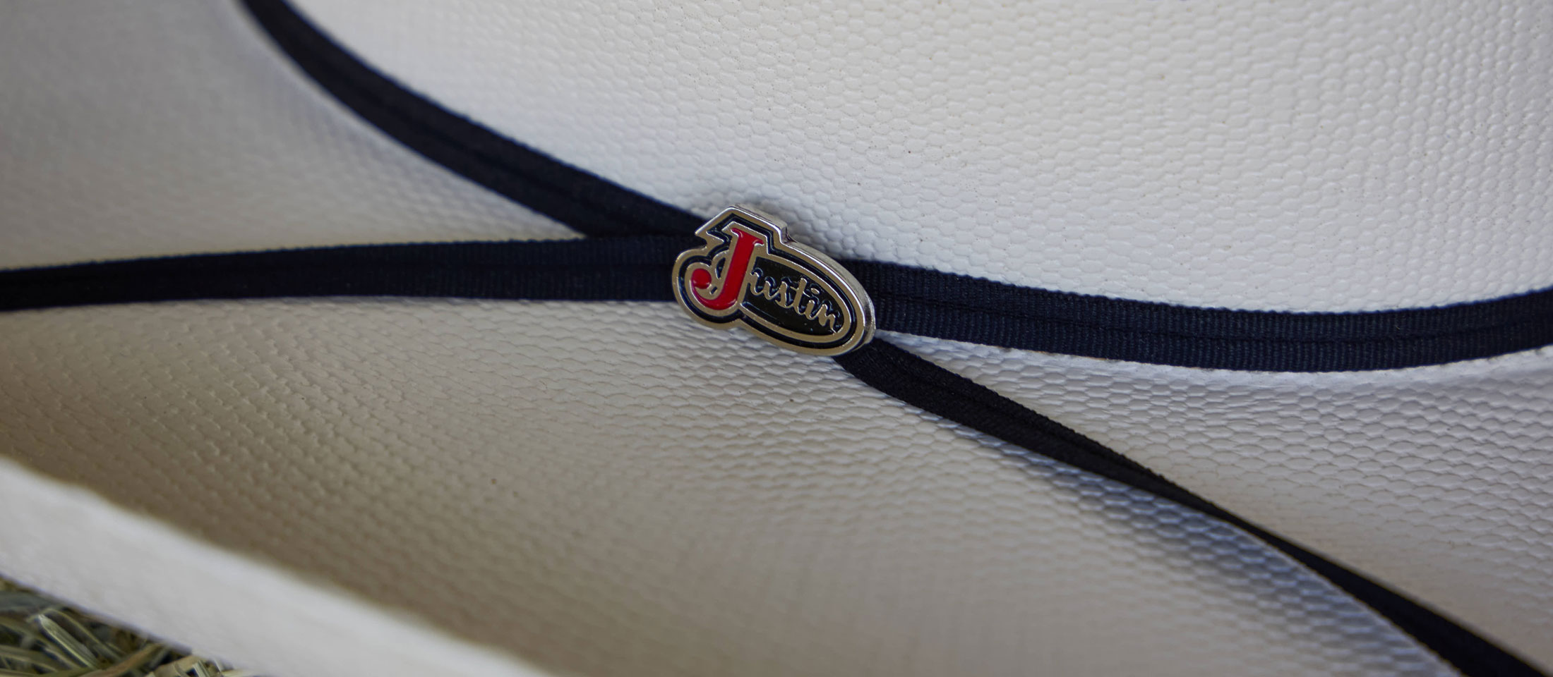 A close up of a Justin Straw cowboy hat.